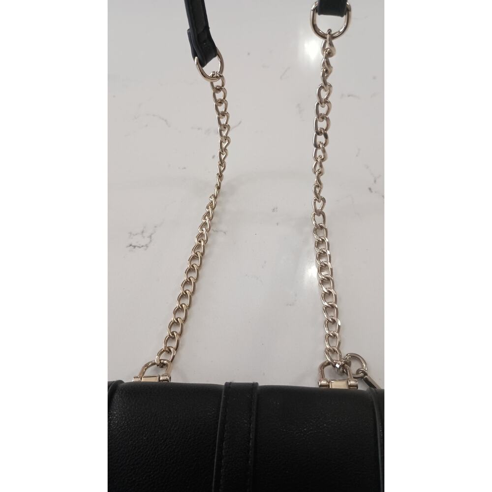 The Express Black Crossbody embellished with Bow metal grommets flap  closure. - Picture 4 of 12